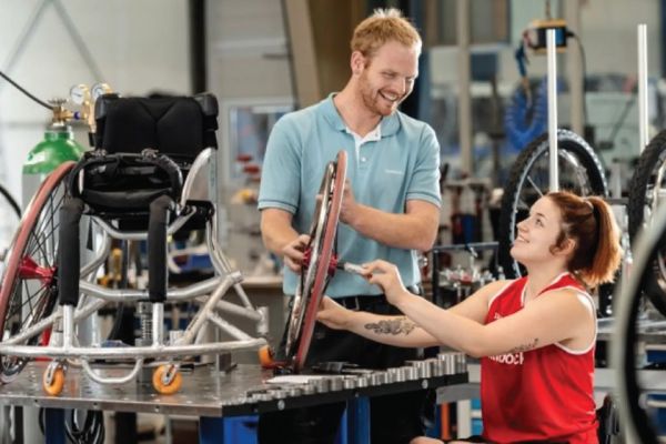 technician and wheelchair athlete